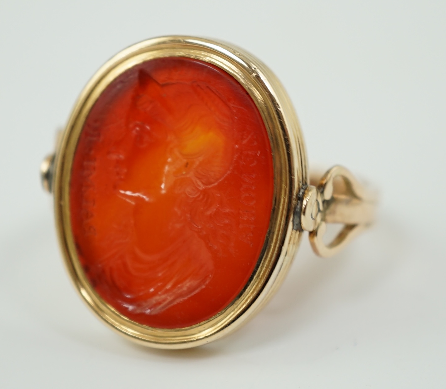 A 19th century gold and intaglio carnelian set oval signet ring